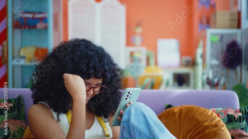 Beautiful young hispanic woman managing her home clothing e-commerce business from home - Female designer owns online shopping store, concepts of home business and reselling second hand accessories