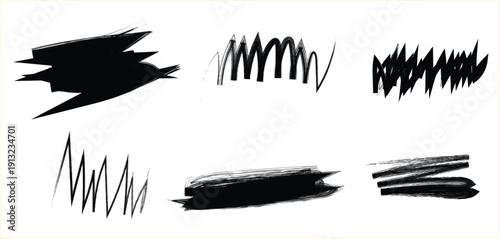 Collection of expressive black brush strokes and scribbles on a white background for artistic design