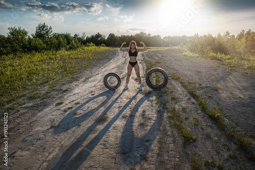 Wallpaper Mural A young woman deals with car tires. Torontodigital.ca