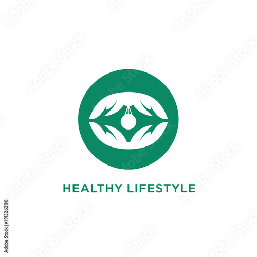Hands holding a green emblem symbolizing healthy living