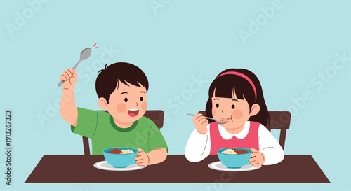 Young boy and girl sit at a table while enjoying a healthy meal from blue bowls with spoons against a soft blue background in a home kitchen.