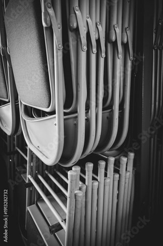 stacked metal chairs hanging