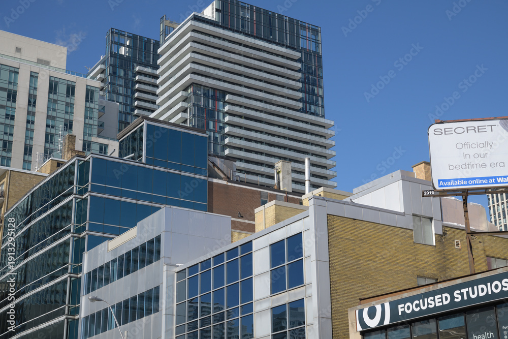 Fototapeta premium buildings and sign of Focused Studios Inc, a physical fitness program, located at 250 Eglinton Av E, Toronto