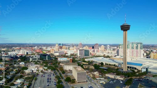 Aerial view featuring downtown San Antonio skyline visible in the distance.