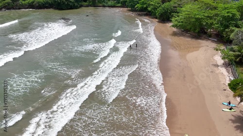Galle, Sri Lanka, November 3, 2025: Devata Beach in the galle city and surfers riding in the waves