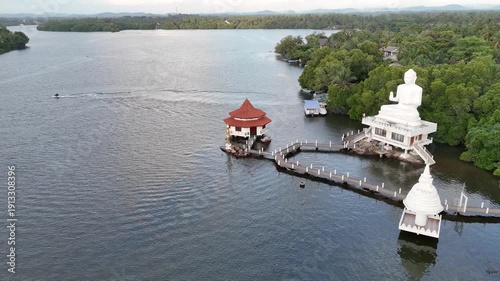 Kalutara, Sri Lanka – December 2, 2025: Calm lake view with reflections, lush greenery, and peaceful natural surroundings.