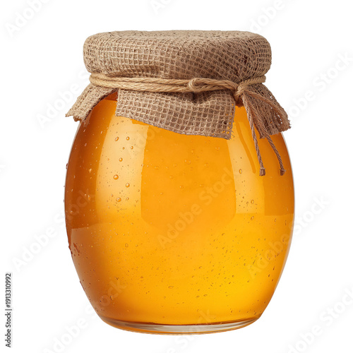 Honey Jar Placed on a White Surface in a Kitchen Setting During Daylight