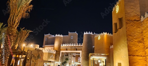 Принти на полотні This photo captures a scene at the Boulevard World amusement park in Riyadh, showcasing a recreation of traditional Saudi architecture
