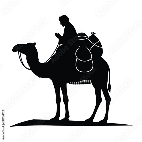 A man rides a camel through the desert landscape