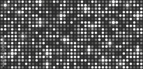 Glowing silver halftone dot background. Bright circular lights grid on dark. White grey futuristic and vibrant texture pattern. Geometric minimal digital design. Abstract vector illustration