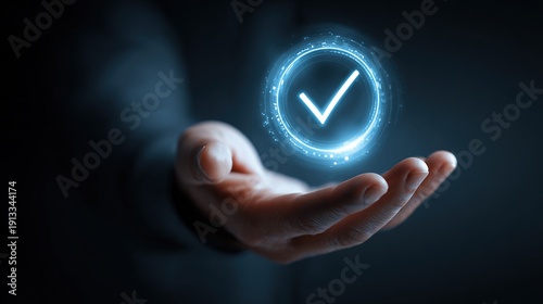 Hand holding a glowing check mark signifying agreement and successful accomplishment