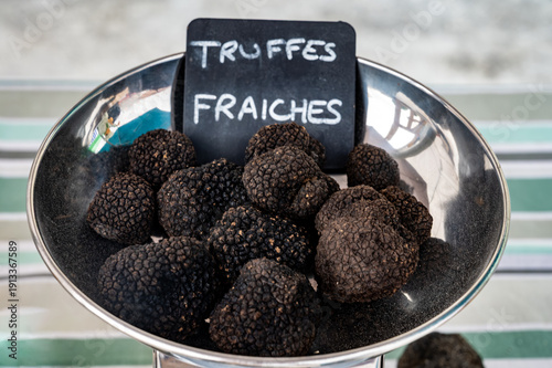English translation: Fresh truffles, mushrooms black truffles on farmers market in Dordogne, Perigord, France