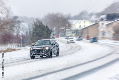 Photography Dark crossover in snowfall on city street with motion blur
