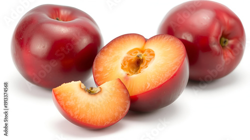 A single juicy plum with a slice, isolated on a white background, emphasizing a rich and flavorful fruit
