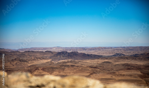 Bild auf Leinwand Scenic Ramon Crater Landscape Under Blue Sky