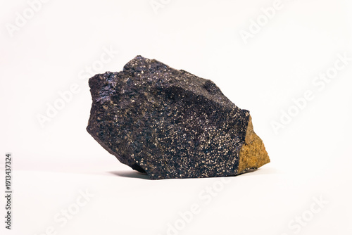 Foto Dark grey volcanic rock fragment