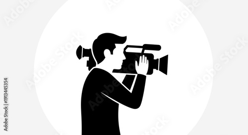 Man holding a video camera.