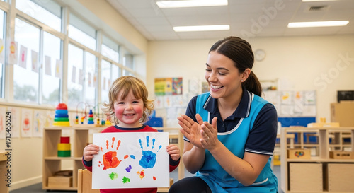 Happy child with handprint art and proud caregiver in classroom kids school life learn study undergr