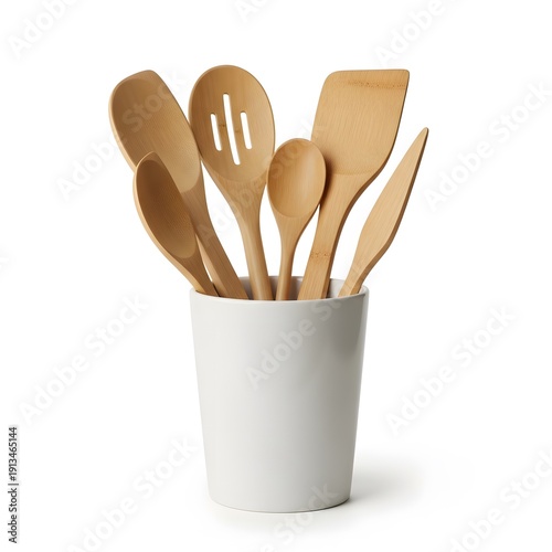Assorted kitchen utensils made of wood arranged in a cylindrical container on a plain surface