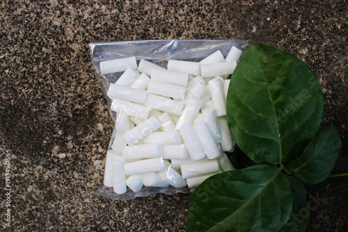 Top view of a pack of cigarette filters outdoors.