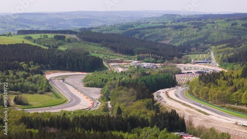 belgium f1 formula one circuit unfolds through ardennes eau rouge section bends forest run off areas belgian countryside visible spa francorchamps region 