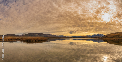 Unusual cloudscape over the countryside around the shore of an the Maori Lakes near Lake Heron in Hakatere conservation area