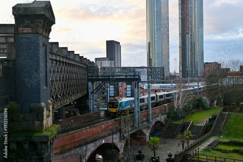 Buildings and train in Manchester, UK