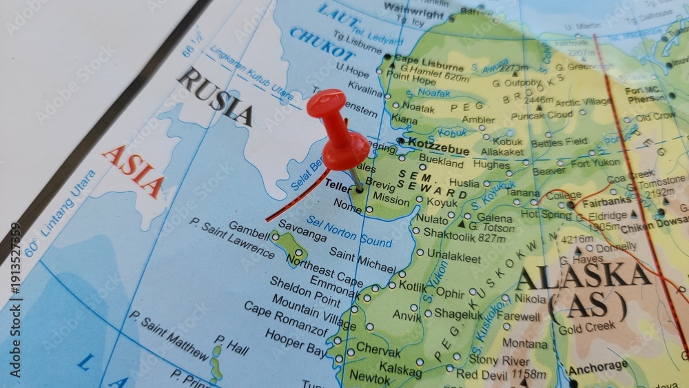 Naklejka premium View of Teller, City in Nome Census Area, Alaska, United States, on a geographical map of America, seen using a magnifying glass
