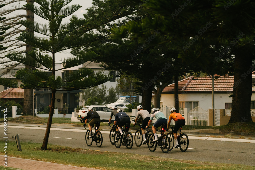 Obraz premium Silhouette of Group Jogging at Sunrise by the Ocean with Motorcycle, Fitness and Wellness Lifestyle Concept on Coastal Road