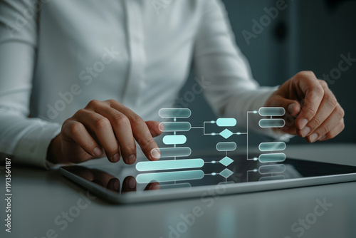 Businesswoman uses tablet to interact with digital flowcharts and organizational diagrams for project management and strategy planning.
