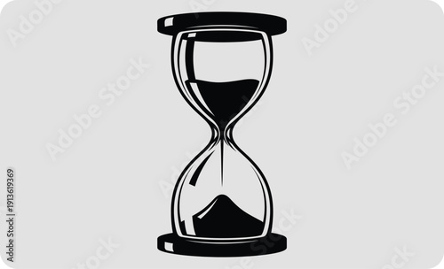 Hourglass with black sand on a gray background