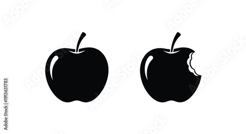 Two apples one bitten presented as a striking black silhouette