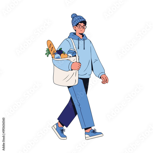 A young person in a blue beanie and hoodie carrying groceries in a tote bag