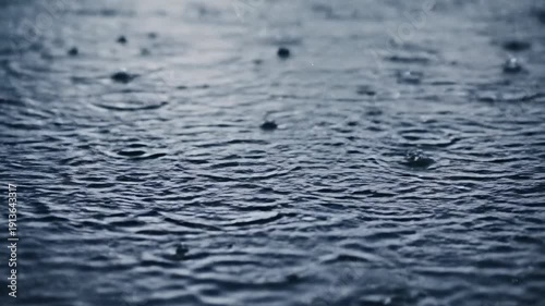 Rainfall on Water Surface Creating Ripples.