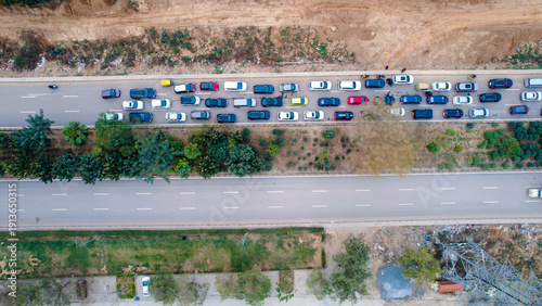 Drone aerial view of heavy traffic congestion on a Gurgaon highway, showing urban commute, road infrastructure, and city transportation challenges.