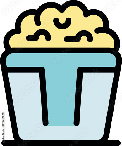 Popcorn overflowing from a classic bucket, perfect for enjoying a film