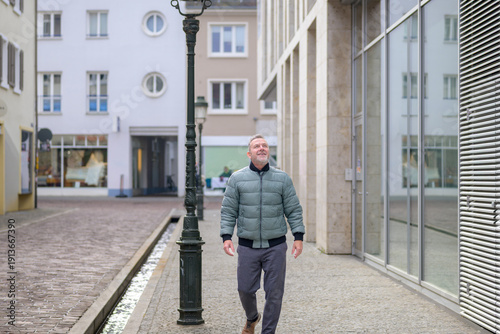 Wallpaper Mural Senior man walking through city Torontodigital.ca