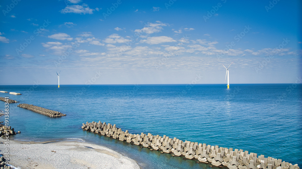 Obraz premium 少し雪解けをした日本の富山県にある黒部川扇状地とその沿岸周辺の様子