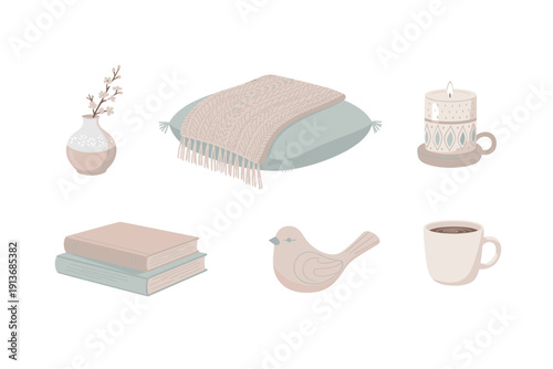 Cozy scene with books, a cup, a candle, and decorative items