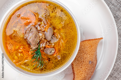 Billede på lærred Rustic Chicken Giblet and Spelt Soup with Rye Toast