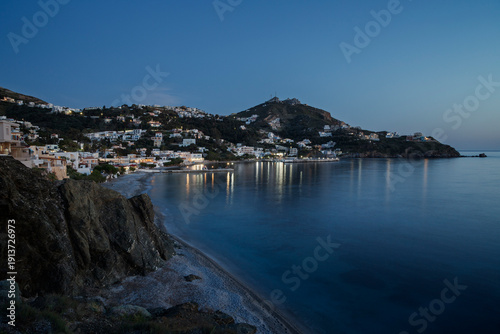 Hilly landscape, coastline and the Aegean Sea towards the village of Mirties on Kalymnos island in Greece at dusk.