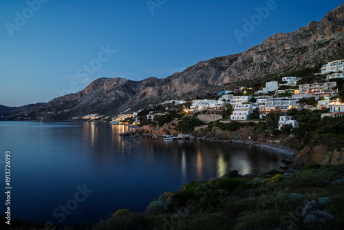 Mountainous and rugged landscape, coastline and the Aegean Sea towards the village of Masouri (Massouri) on Kalymnos island in Greece at dusk.