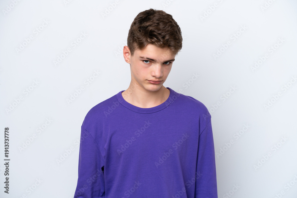 Fototapeta premium Teenager Russian man isolated on white background with sad expression