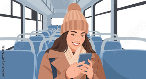 Woman in warm clothing smiling at her phone on an empty bus