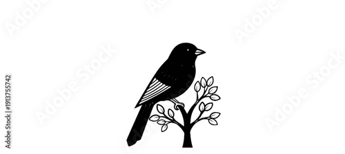 Black bird perched on a simple tree branch with leaves