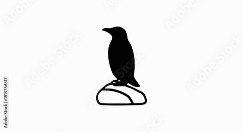 Black penguin silhouette stands proudly on a rounded stone