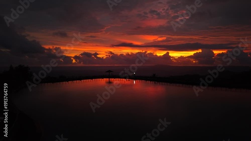 A beautiful and cinematic view of the Nglanggeran reservoir at sunset. An artificial lake for irrigation and a popular tourist destination for enjoying the hilly scenery.