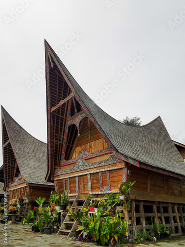 The Bolon House is a traditional house of the Batak people in North Sumatra,built on stilts with a distinctive curved saddle roof,often used as a place to live together and for large family gatherings