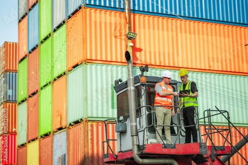 Fotografie Industrial safety leaders review site assessment, hazard prevention checklist at cargo terminal