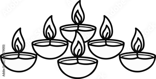 Row of traditional oil lamps with lit flames